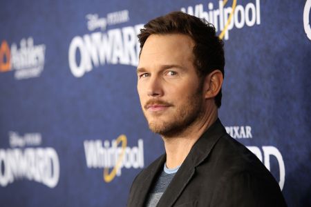 Chris Pratt in a brown coat caught on the camera.
